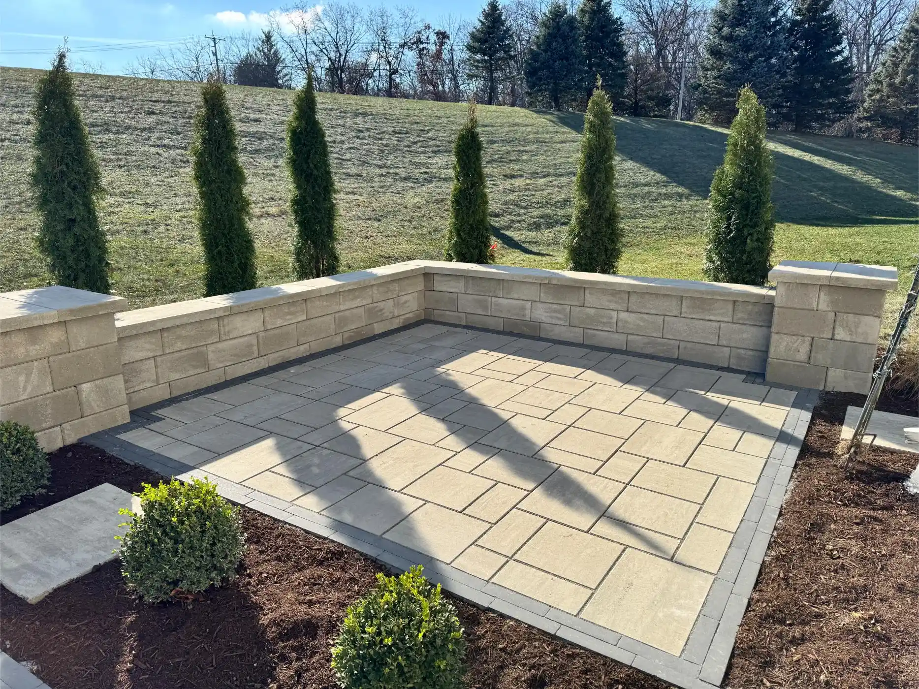 English Ln Project: Paver Patio, Seat Walls, Privacy Planting (photo 1 of 9)