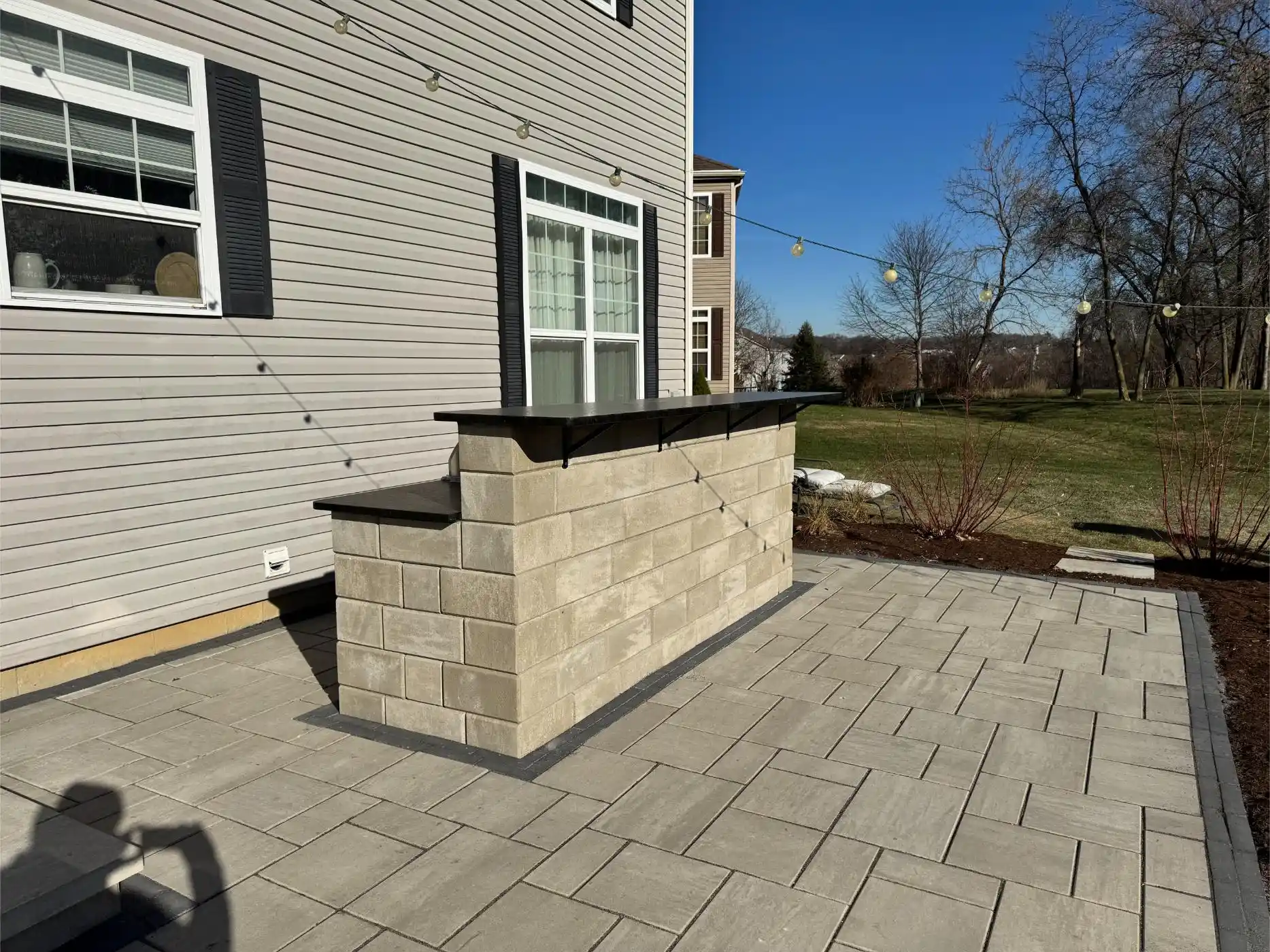 English Ln Project: Paver Patio, Seat Walls, Privacy Planting (photo 3 of 9)