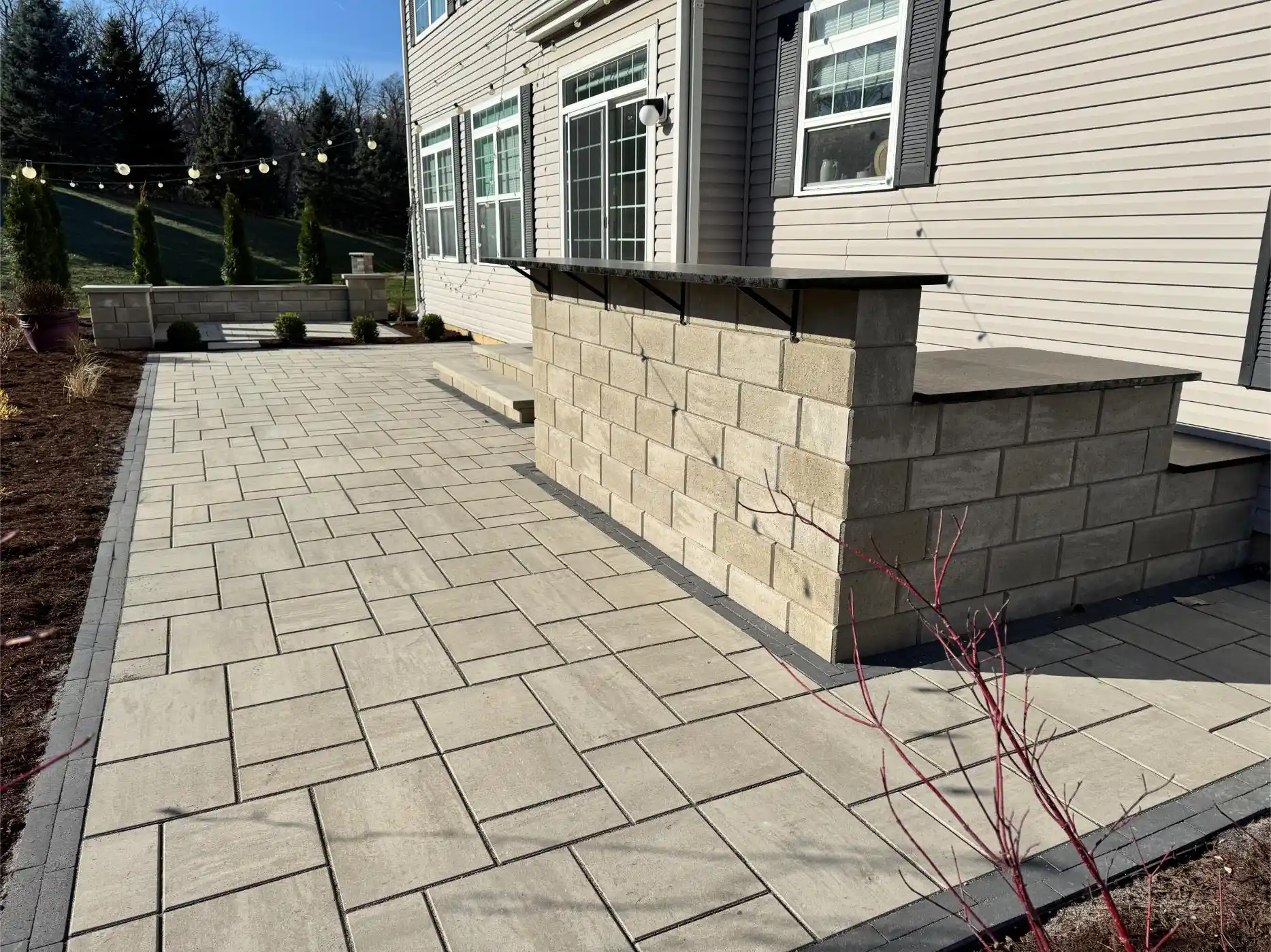 English Ln Project: Paver Patio, Seat Walls, Privacy Planting (photo 4 of 9)