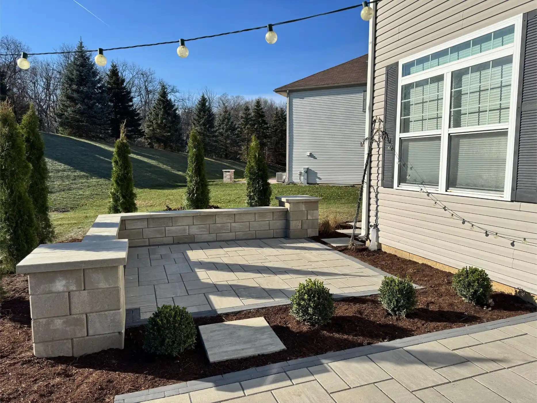 English Ln Project: Paver Patio, Seat Walls, Privacy Planting (photo 8 of 9)